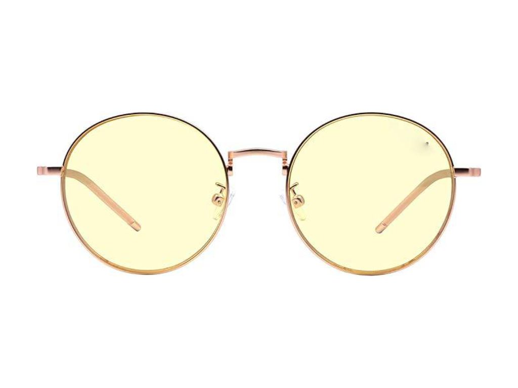 Thin round rose-gold-tone wire glasses with pale yellow tinted lenses
